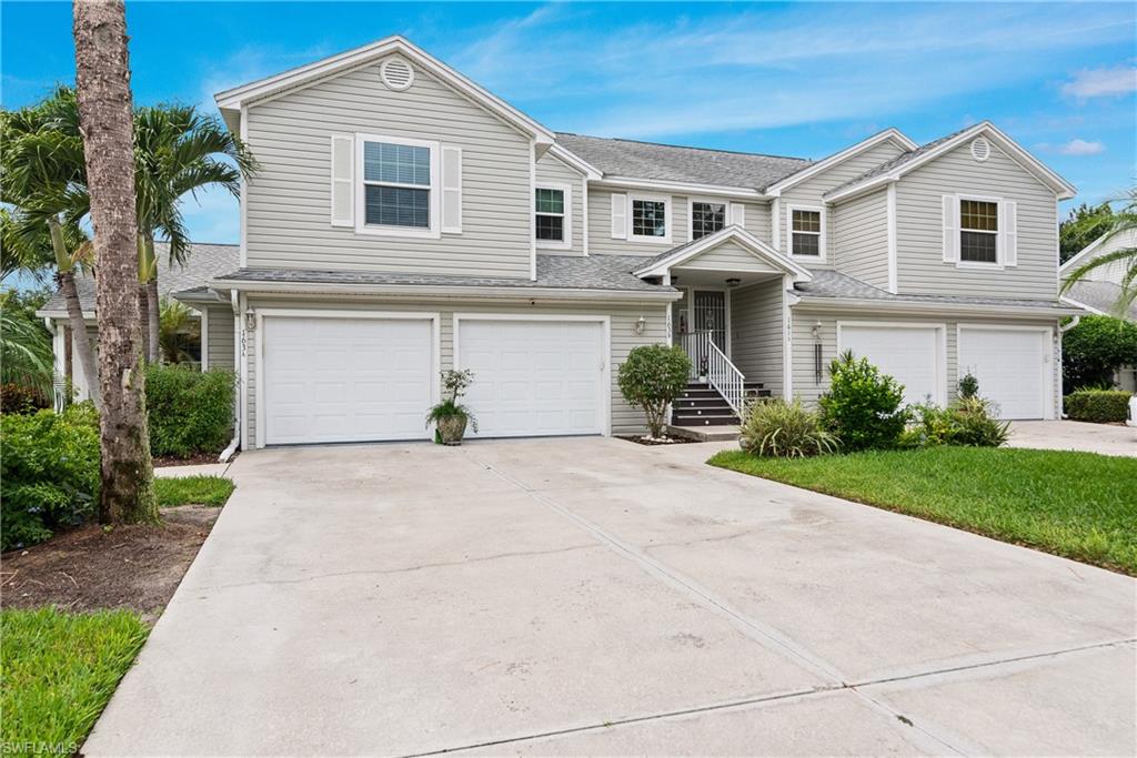 Attached private garage with a long driveway plus 2 cars .