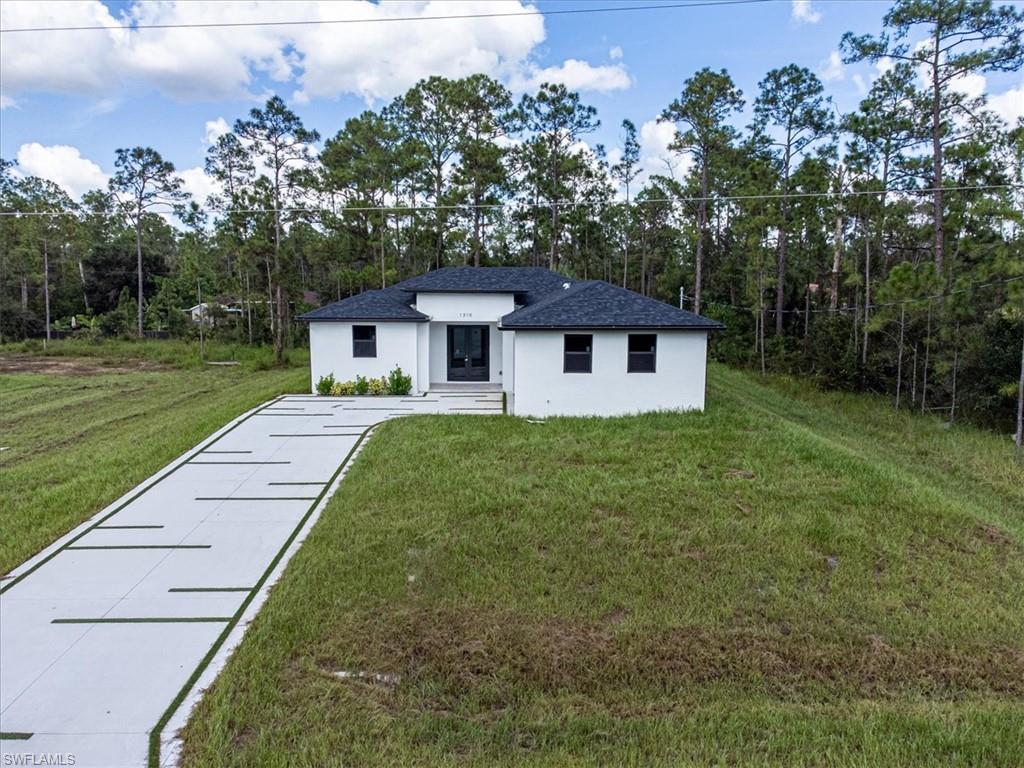 View of front of property with a front yard