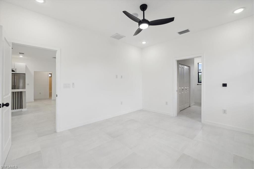Spare room with ceiling fan