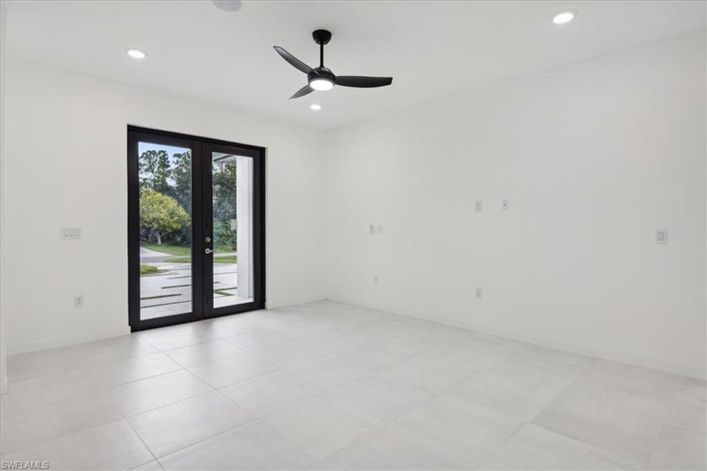 Empty room featuring ceiling fan