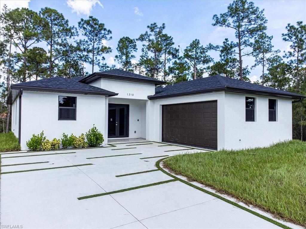 View of front of property with a garage