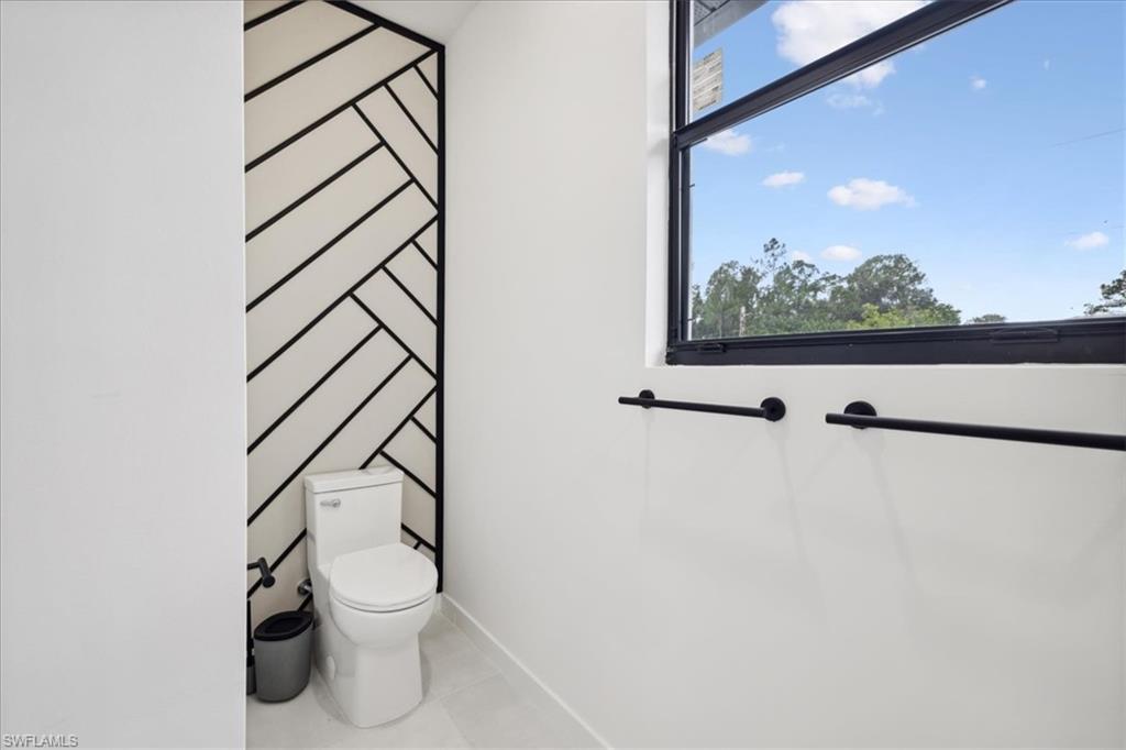 Bathroom featuring toilet and tile patterned floors