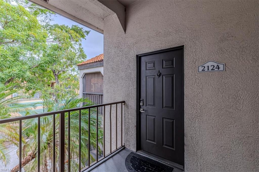 View of exterior entry with stucco siding