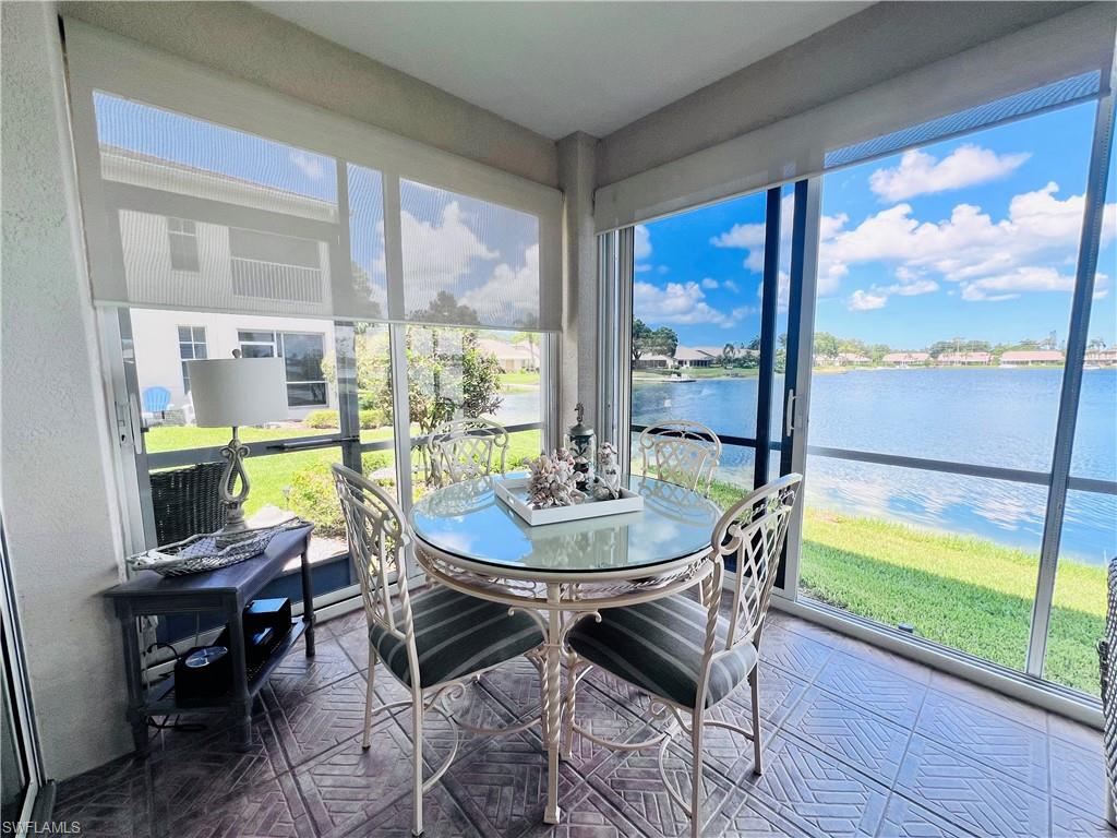 Screened-in lanai with sliding glass doors.