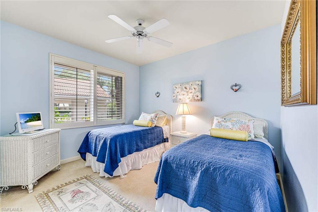GUEST BEDROOM WITH TWIN BEDS AND PLANTATION SHUTTERS