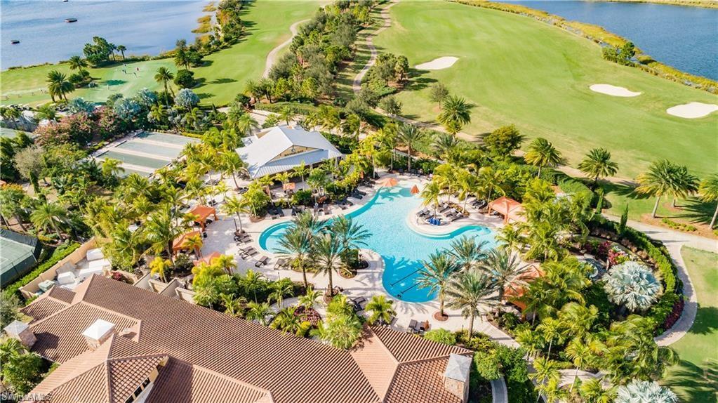 Aerial view featuring a water view and view of golf course