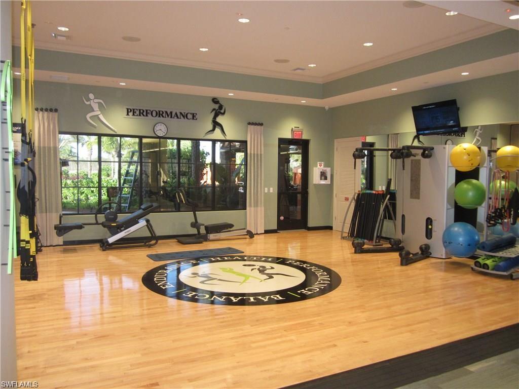 Workout area with recessed lighting, crown molding, and wood finished floors