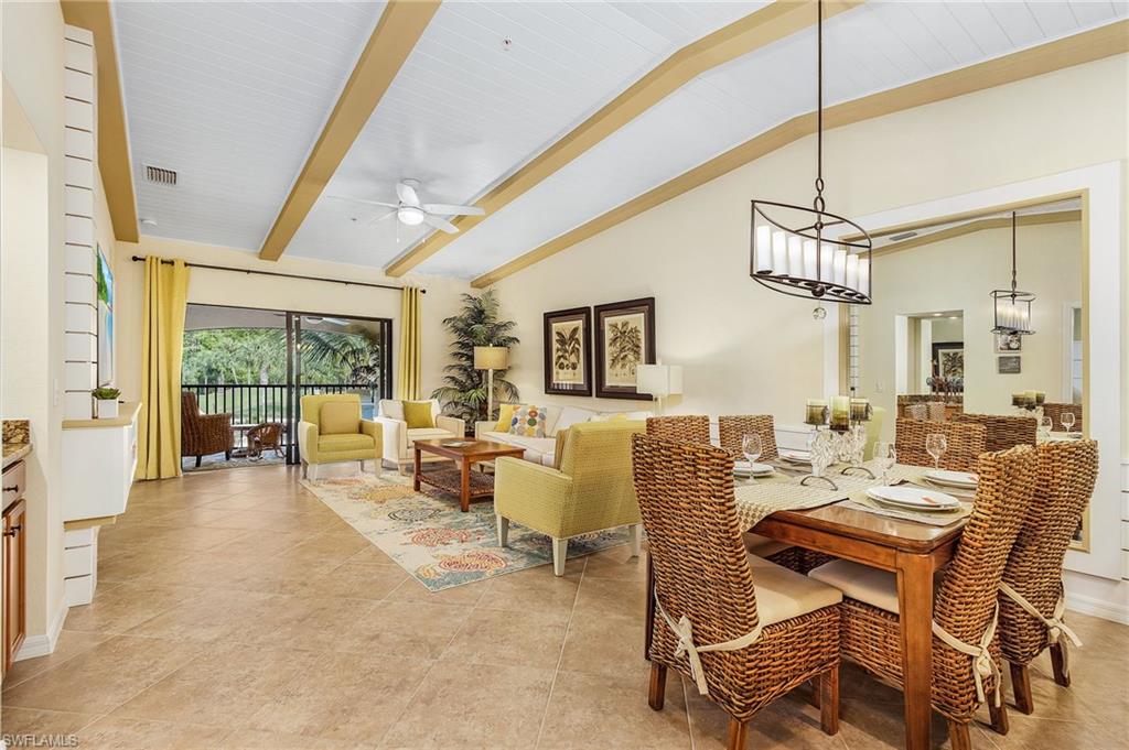 Dining area with a ceiling fan and light tile patterned floors