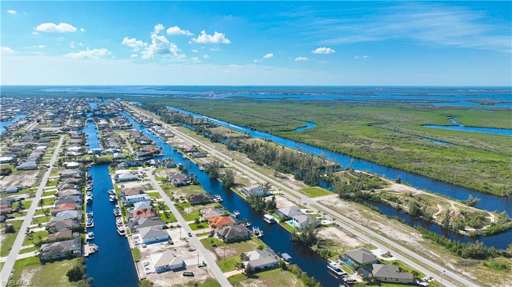 Aerial perspective showcasing a residential area with extensive canal frontage