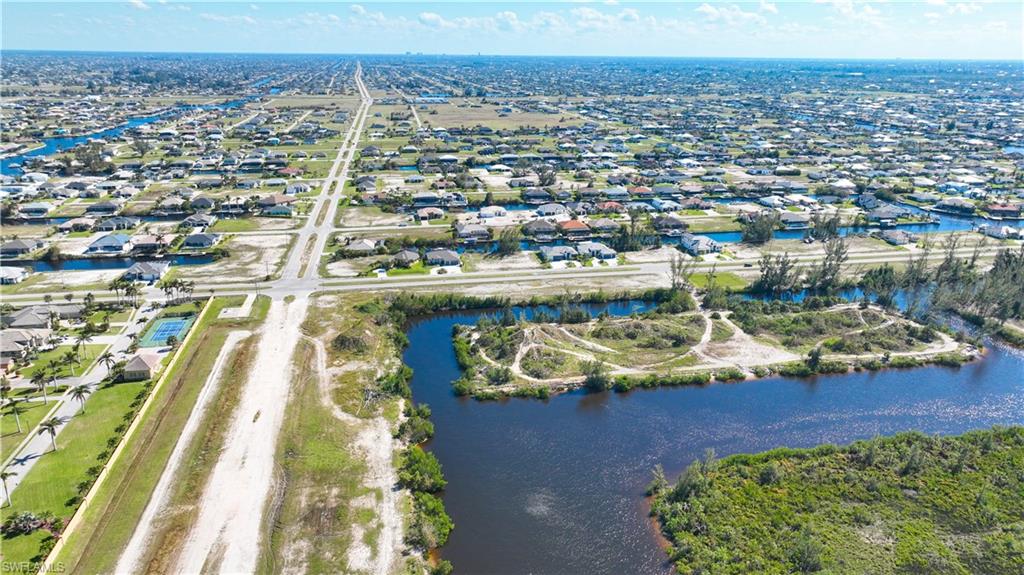 Expansive land parcel featuring direct water frontage and undeveloped terrain