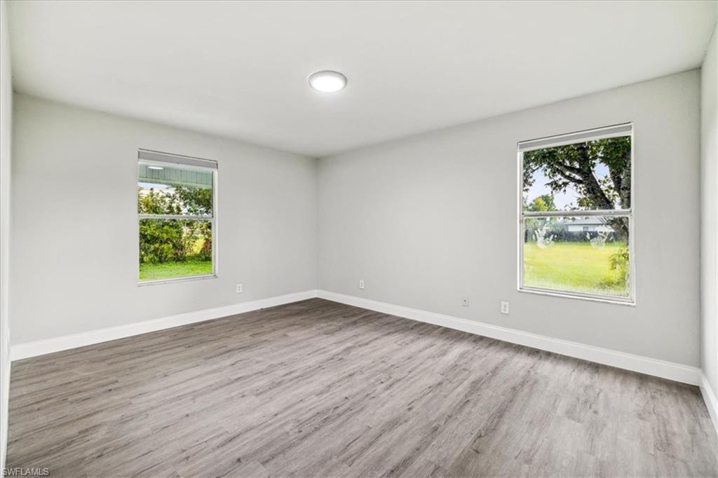 Unfurnished room featuring light wood-type flooring