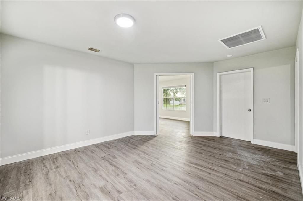 Empty room featuring hardwood / wood-style floors