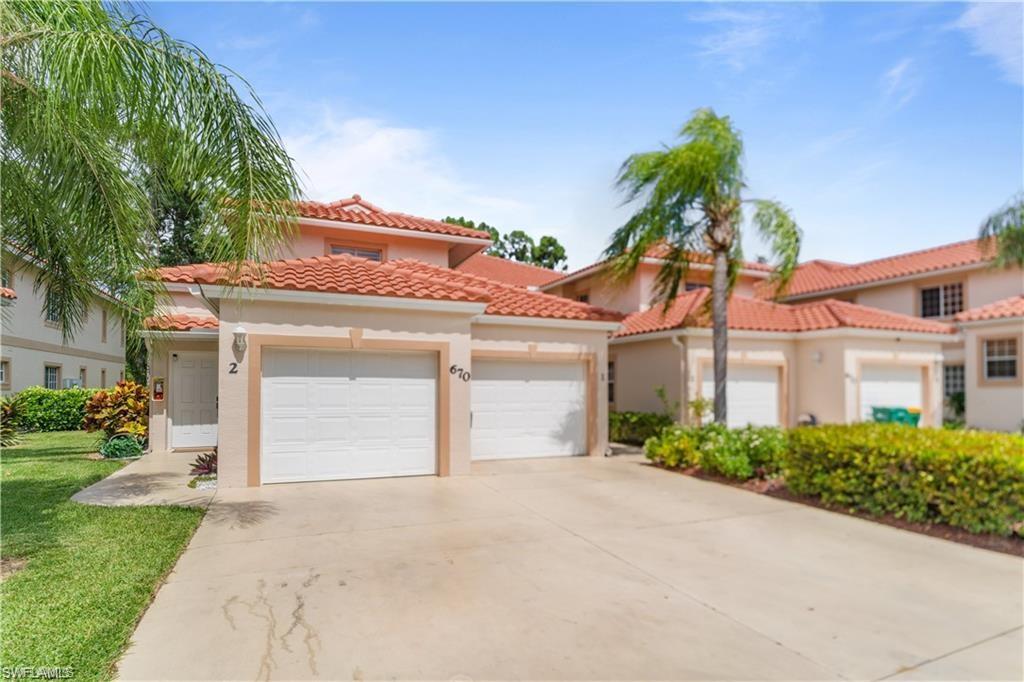 Mediterranean / spanish-style house featuring a garage