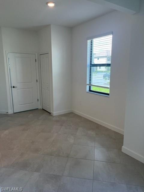 Spare room with baseboards