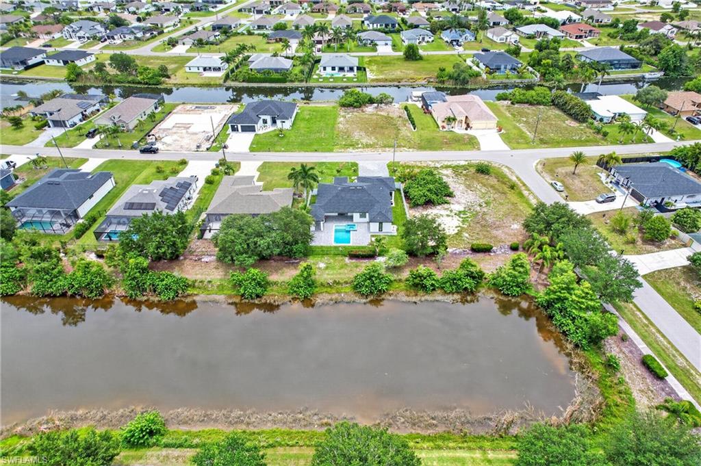 Aerial perspective showcasing a residential community with waterways