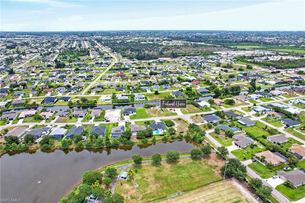 Aerial perspective highlighting a residential community with canals and waterways