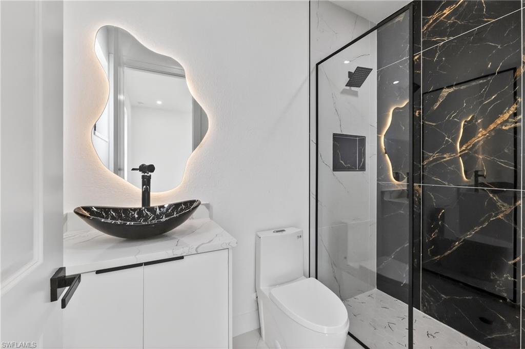 Contemporary bathroom featuring a black and white color palette