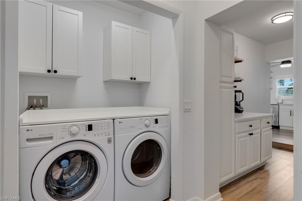 Dedicated laundry area with built-in cabinetry