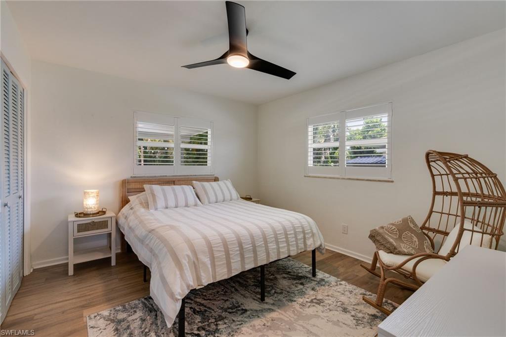 Comfortable guest bedroom with plantation shutters
