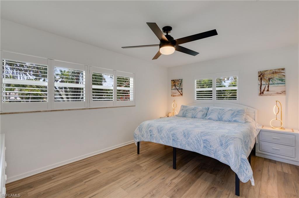 Spacious primary suite with plantation shutters