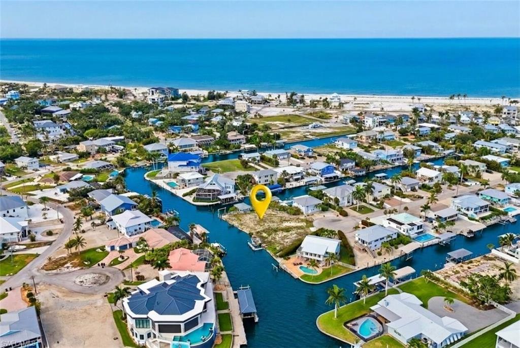 Waterfront parcel featuring direct canal access, an unbuilt lot, and proximity to the Gulf of Mexico shoreline - Virtually Edited Image