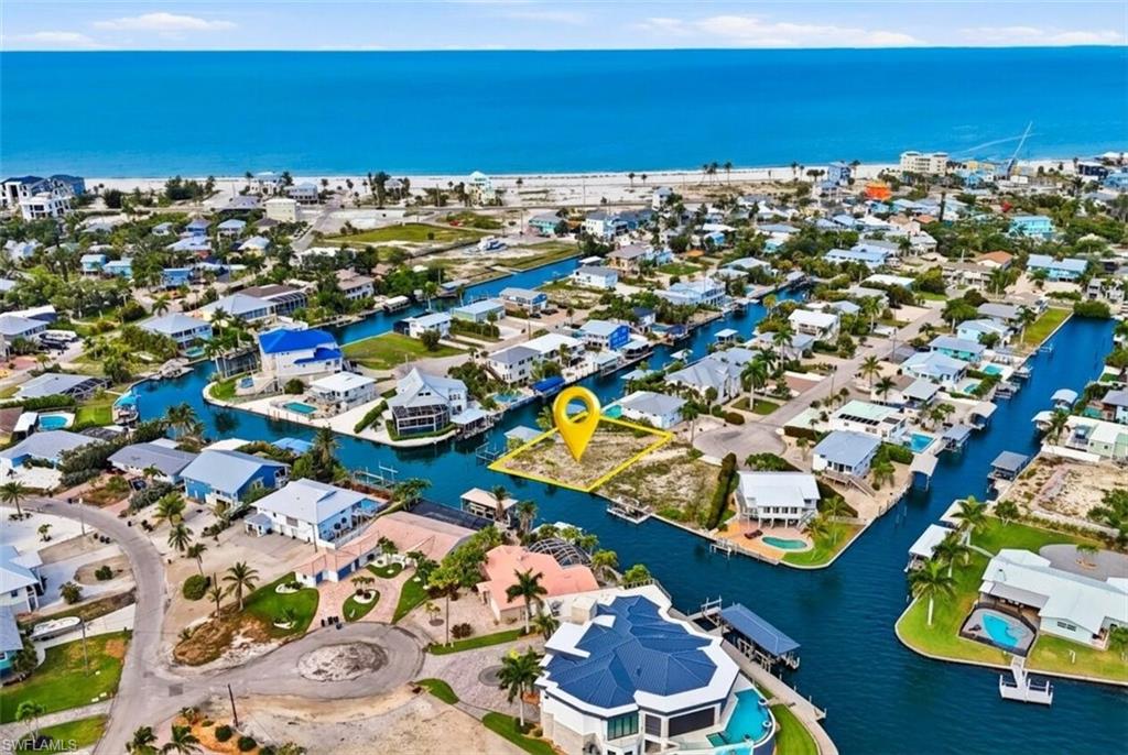 Vacant waterfront lot featuring direct canal access, a short distance from the Gulf of Mexico - Virtually Edited Image