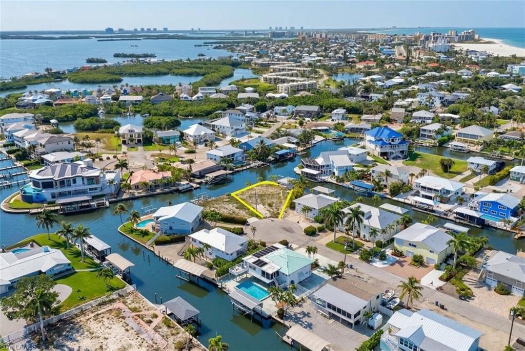 Vacant lot offering waterfront access, situated on a canal, with proximity to the Gulf of Mexico - Virtually Edited Image