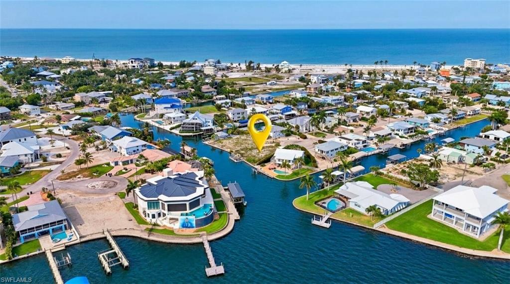 Waterfront community featuring direct Gulf access, private boat docks, and individual swimming pools - Virtually Edited Image