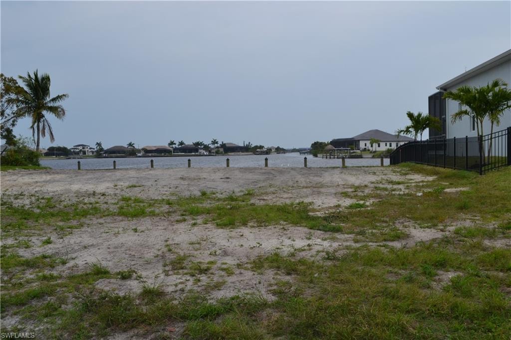 View of yard with a water view