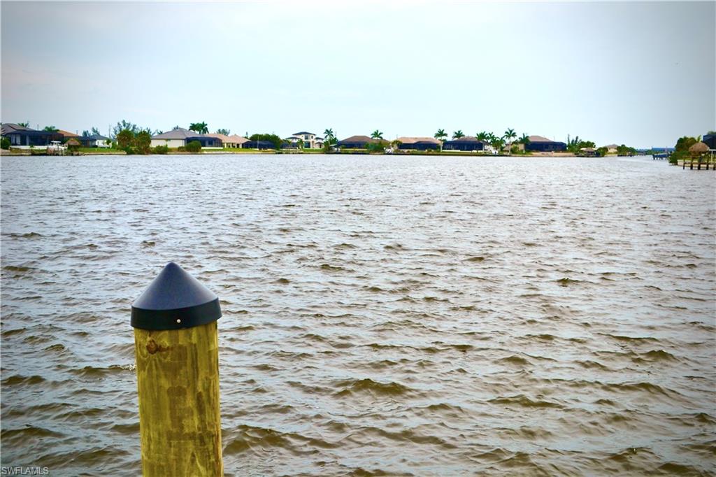Property view of water featuring a boat dock