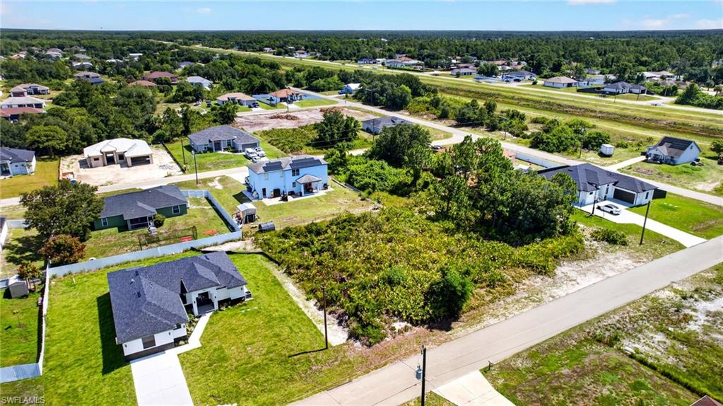 Expansive lot with mature trees, providing a natural setting and ample space