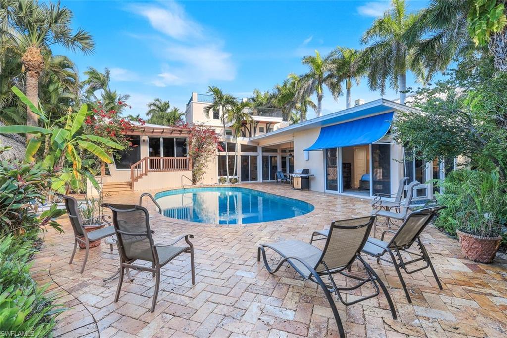 lush landscaped paver pool area