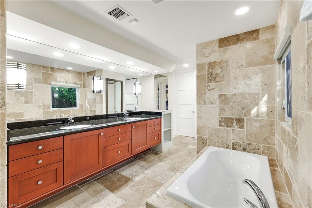 Spacious updated primary bath w/ separatetub and walk-in shower