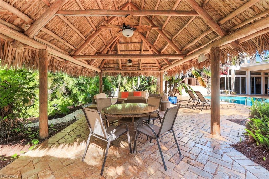 Tiki hut features covered dining andconversation area