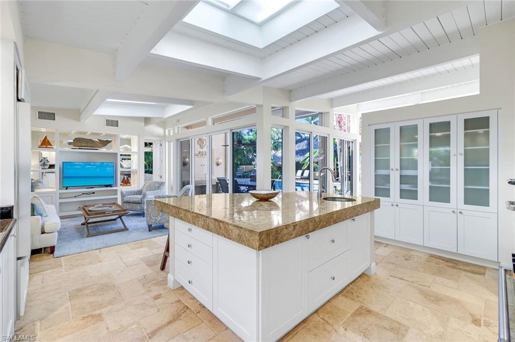 open to family room and outdoor dining area