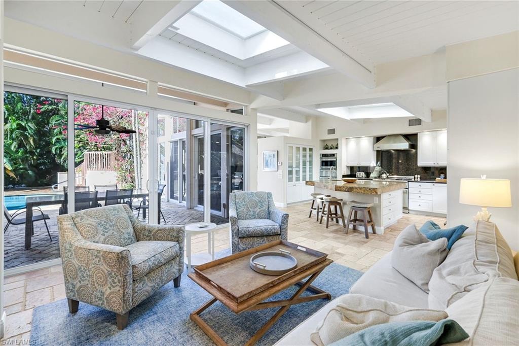 Sun filled, open to kitchen and pool area