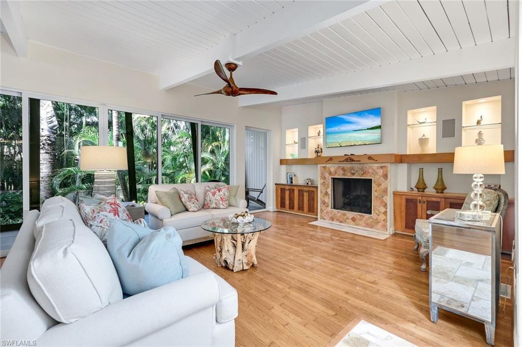 Cozy living room w/ fireplace and sunroomaccess