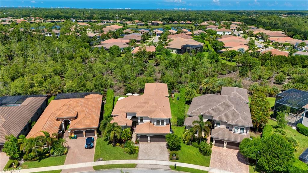 Aerial perspective showcasing a residential community with lush green landscaping