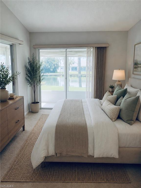 *Virtually Staged* Sliding glass doors opening to a private balcony overlooking a water feature