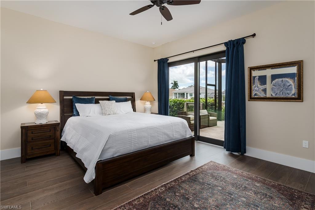 Spacious room featuring wood-finish flooring, a ceiling fan, and light-toned walls