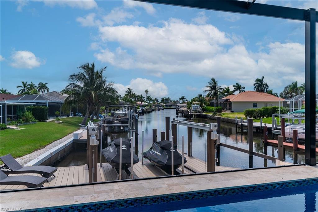 Waterfront canal with two boat lifts and a substantial dock