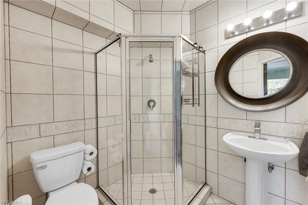 Pool bath features a walk-in shower.