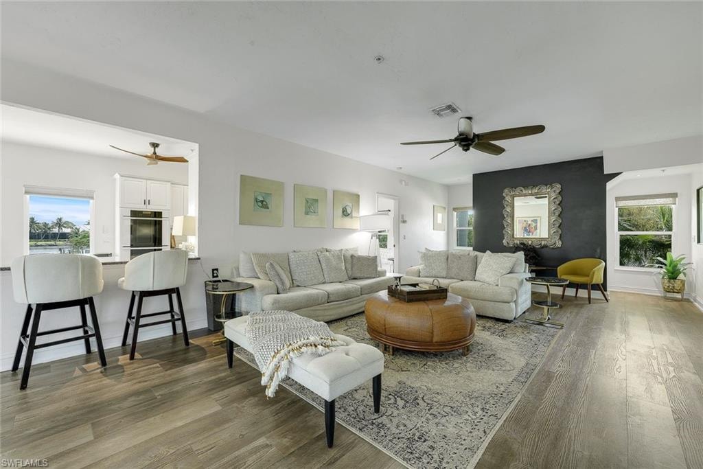 Open living area with easy access to the kitchen, outdoor lanais, and the pool.