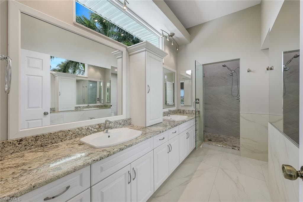 Spa-like ensuite with separate sink areas, a gorgeous shower, plenty of cabinet space and a TON of natural light!
