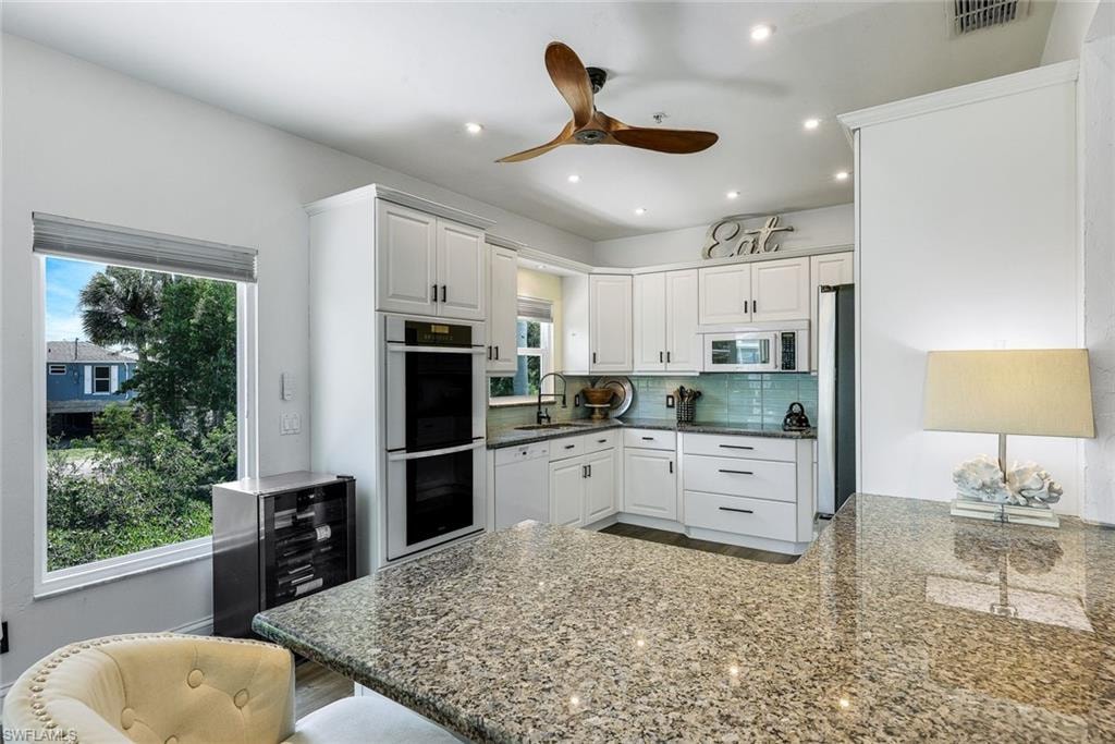 View of kitchen from formal dining area.