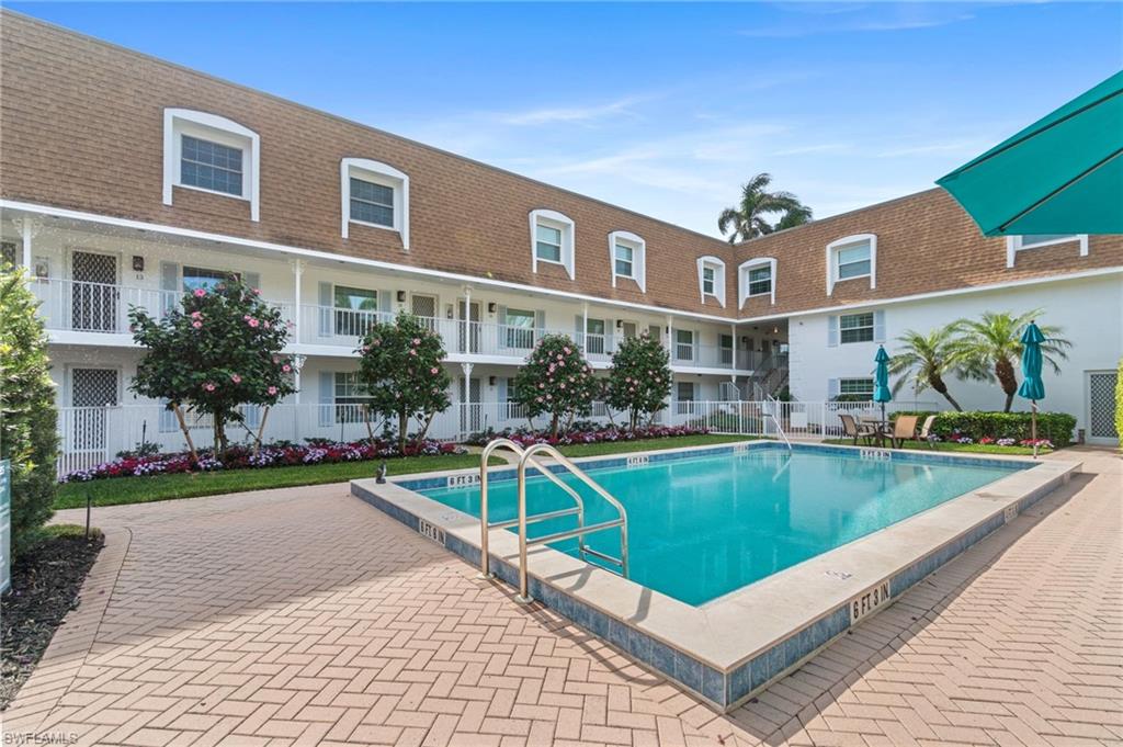 Community swimming pool with brick paver surround