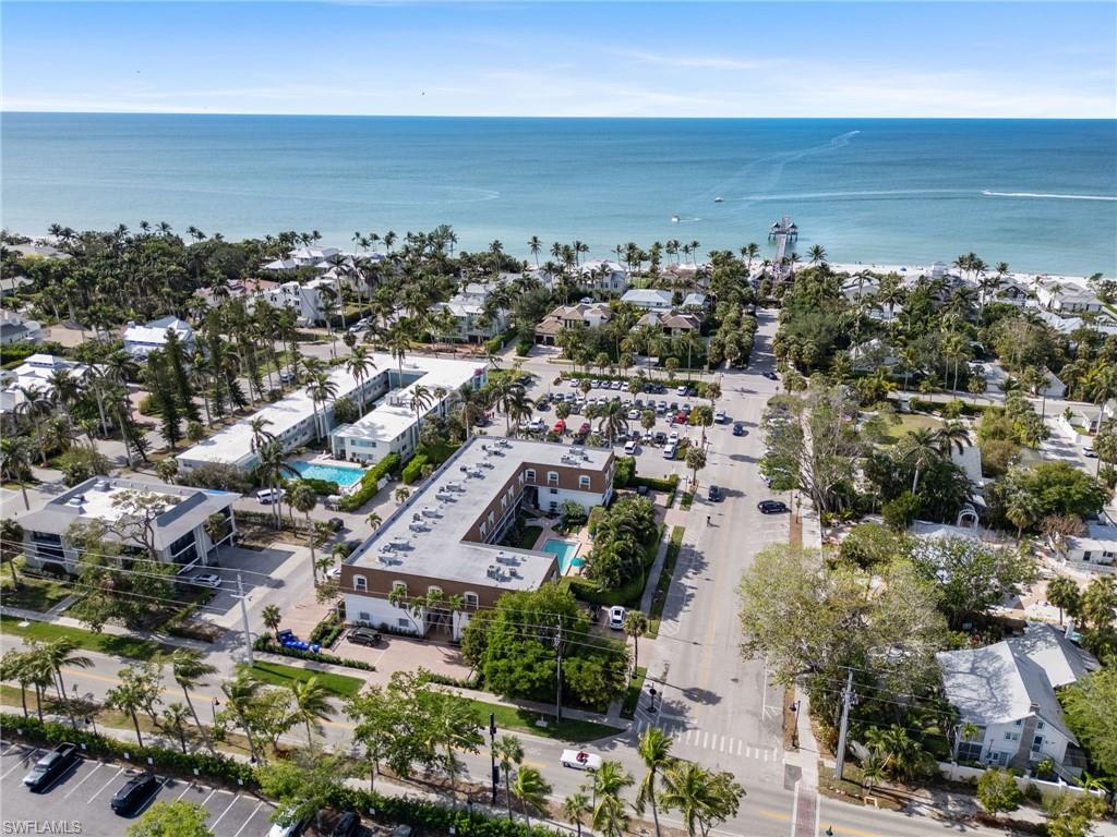 Coastal property featuring direct Gulf of Mexico frontage and a prominent pier