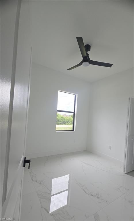 Neutral white walls complemented by large format tile flooring with a subtle veining pattern