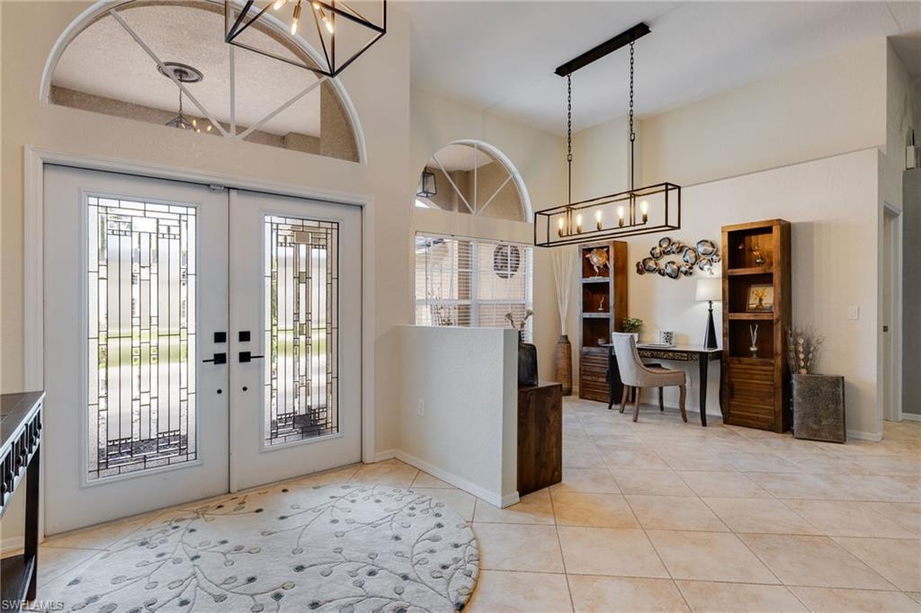 Matching tile throughout the entire home.  A welcoming foyer with beautiful custom double doors.
