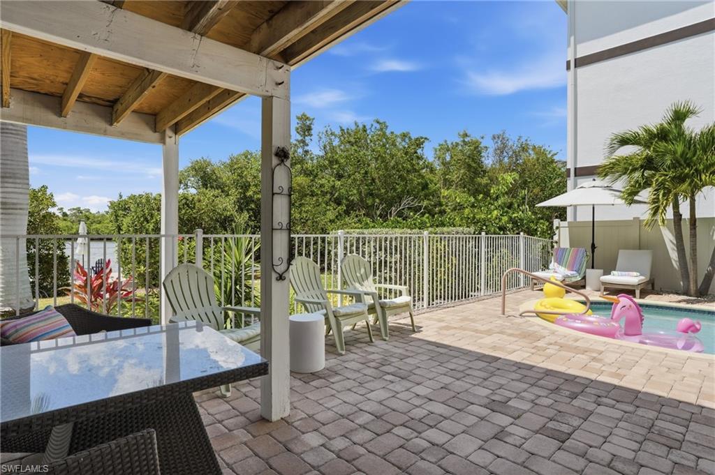 Covered outdoor patio with a paver surface - Virtually Edited Image